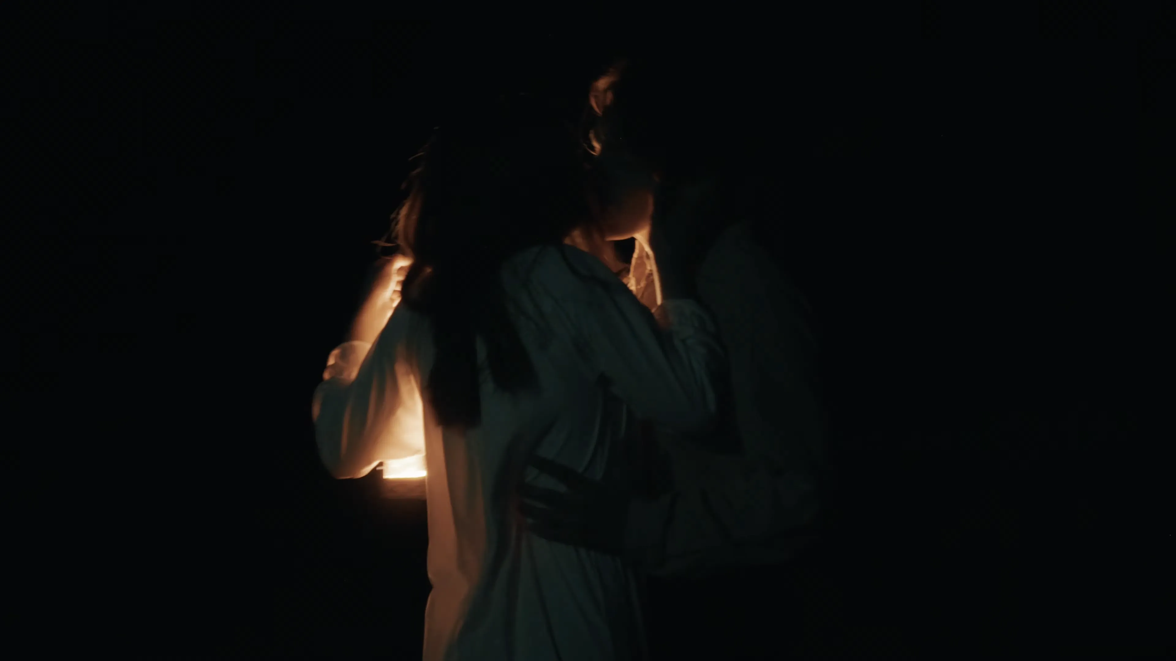 Production frame capturing a moment of visual poetry through camera operation and lighting design